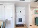 Condo entryway with white door and adjacent storage at 618 Bird Bay S Dr # 202, Venice, FL 34285