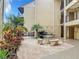 Community courtyard featuring a table and benches at 618 Bird Bay S Dr # 202, Venice, FL 34285