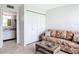 Cozy den with a sofa, wicker table, and built-in storage at 618 Bird Bay S Dr # 202, Venice, FL 34285