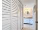 Bathroom with white cabinets, granite countertop and tiled floor at 618 Bird Bay S Dr # 202, Venice, FL 34285