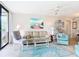 Light and airy living room with comfortable seating and coastal decor at 618 Bird Bay S Dr # 202, Venice, FL 34285