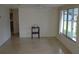 Empty living room with terrazzo floors at 205 Venice East Blvd, Venice, FL 34293