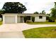 Ranch-style home with a single car garage at 205 Venice East Blvd, Venice, FL 34293