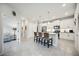 Modern kitchen with white shaker cabinets, granite countertops, and an island at 21008 Fetterbush Pl, Venice, FL 34293