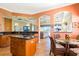 Open kitchen design overlooking the living room and golf course views at 157 Palazzo Ct, North Venice, FL 34275