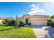 One-story house with two-car garage and landscaped lawn at 157 Palazzo Ct, North Venice, FL 34275