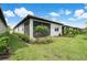 Home features a screened patio and landscaped backyard at 240 Teramo Way, Nokomis, FL 34275