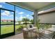 Relaxing screened patio overlooking tranquil lake view at 240 Teramo Way, Nokomis, FL 34275