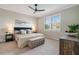 Spacious bedroom with plush bedding and large window at 240 Teramo Way, Nokomis, FL 34275
