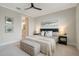 Serene bedroom featuring a cozy bed and neutral decor at 240 Teramo Way, Nokomis, FL 34275
