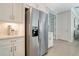 Modern kitchen features stainless steel appliances and white cabinetry at 240 Teramo Way, Nokomis, FL 34275
