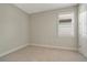 Simple bedroom with neutral walls and carpeting at 240 Teramo Way, Nokomis, FL 34275