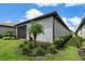 Home features a screened patio and landscaped backyard at 240 Teramo Way, Nokomis, FL 34275