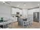 Spacious kitchen with island and stainless steel appliances at 20318 Minuet Pl, Venice, FL 34293