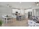 Modern kitchen with an island and white cabinets at 20318 Minuet Pl, Venice, FL 34293