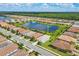 Aerial view showing home's location in a community by a lake at 20318 Minuet Pl, Venice, FL 34293