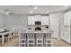 Bright kitchen featuring white cabinets and an island at 20318 Minuet Pl, Venice, FL 34293