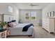 Spacious bedroom with dresser and calming color scheme at 20318 Minuet Pl, Venice, FL 34293