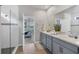 Spa-like bathroom with double vanity and a view into the bedroom at 20318 Minuet Pl, Venice, FL 34293