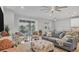Relaxing living room featuring comfortable seating and sliding doors to patio at 20318 Minuet Pl, Venice, FL 34293