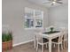 Bright dining room with white table and chairs at 20318 Minuet Pl, Venice, FL 34293