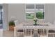 Casual dining area with white table and view to backyard at 20318 Minuet Pl, Venice, FL 34293