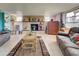 Living room with stone fireplace and animal print rug at 8430 Roosevelt St, Englewood, FL 34224