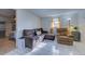 Living room with brown sectional sofa, recliner chair, and wood accent table at 8430 Roosevelt St, Englewood, FL 34224