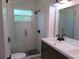 Modern bathroom with double vanity and walk-in shower at 268 Shamrock Blvd, Venice, FL 34293