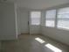 Sunroom with tiled floor, white walls, and multiple windows at 268 Shamrock Blvd, Venice, FL 34293