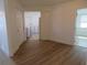 Bright dining area with wood-look floors and access to kitchen at 268 Shamrock Blvd, Venice, FL 34293