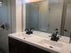 Double vanity with modern sinks and dark brown cabinets at 268 Shamrock Blvd, Venice, FL 34293