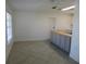 Simple dining room with tile floors and view of kitchen at 268 Shamrock Blvd, Venice, FL 34293