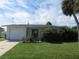 One story home with attached garage and landscaped yard at 268 Shamrock Blvd, Venice, FL 34293