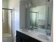 Charming bathroom with double vanity and mosaic tile shower at 268 Shamrock Blvd, Venice, FL 34293