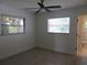 Spacious bedroom with tiled floors and two windows at 268 Shamrock Blvd, Venice, FL 34293