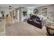 Spacious living room with a leather power recliner sofa and dining area at 612 Guild Dr # 18, Venice, FL 34285