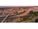 Aerial view of a coastal town at sunset, showing waterways and buildings at 612 Guild Dr # 18, Venice, FL 34285