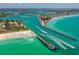 Aerial view of boats passing through a channel leading to the ocean at 612 Guild Dr # 18, Venice, FL 34285