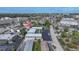 Aerial view of a multi-unit property with ample parking and surrounding businesses at 612 Guild Dr # 18, Venice, FL 34285