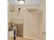 Functional laundry closet with shelving and water heater at 612 Guild Dr # 18, Venice, FL 34285