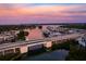 Aerial view of bridge over calm water at sunset, with residential area in background at 612 Guild Dr # 18, Venice, FL 34285