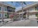 Two-story building with multiple units, balconies, and a courtyard at 612 Guild Dr # 18, Venice, FL 34285