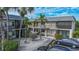 Two-story building with multiple units and parking in a tropical setting at 612 Guild Dr # 18, Venice, FL 34285