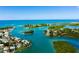 Aerial view of waterfront homes and calm water, showcasing a tropical paradise at 612 Guild Dr # 18, Venice, FL 34285