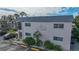 Image of Antigua building exterior, featuring landscaping and parking at 612 Guild Dr # 18, Venice, FL 34285