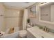 Clean bathroom with tub, shower, and updated vanity at 612 Guild Dr # 18, Venice, FL 34285