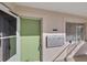 Exterior entryway with a light green door and mailboxes at 612 Guild Dr # 18, Venice, FL 34285