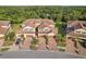 Two-story townhomes with tile roofs in a quiet community setting at 12460 Ghiberti Cir # 202, Venice, FL 34293