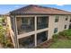 Back exterior view showing two-story building with screened balcony at 12460 Ghiberti Cir # 202, Venice, FL 34293